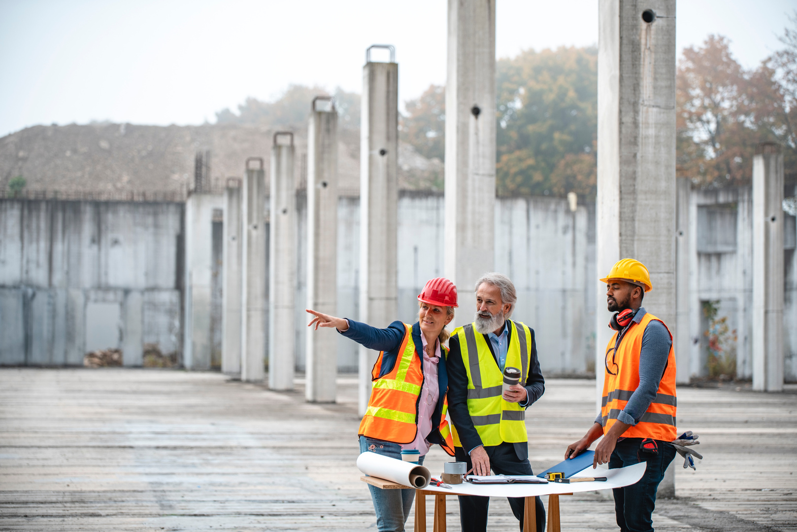 Construction Site Project Managers Working with Foreman